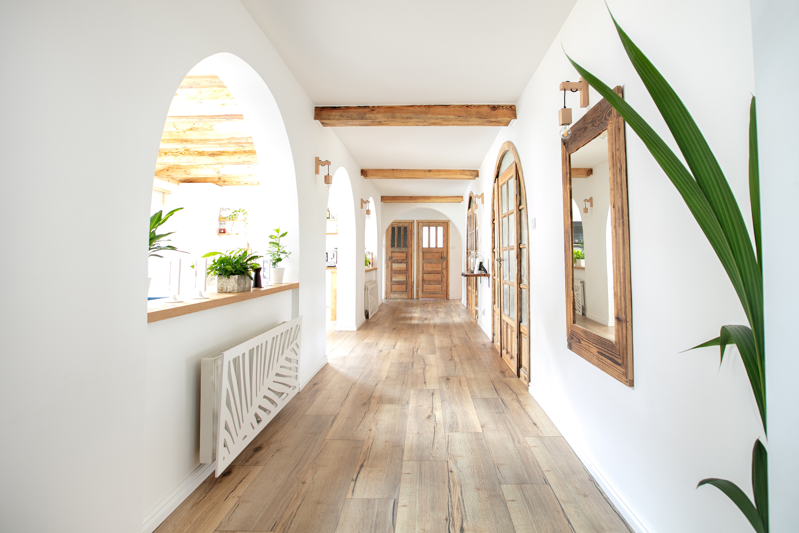 Wooden handmade mirror in hallway.